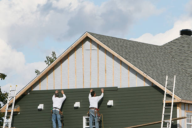Professional Siding technician working in Castalia, NC